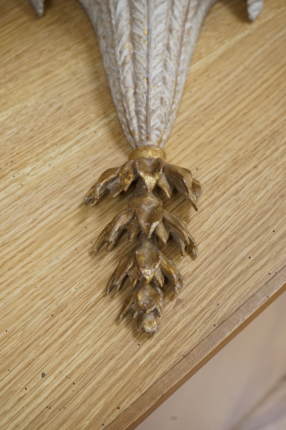 A George III cream painted and giltwood wall bracket, 35cm